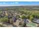 Overhead view of a neighborhood showcases lush landscaping, a swimming pool, and well-maintained community spaces at 265 Valley Xing, Canton, GA 30114