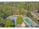 Aerial view showcasing community pool and tennis courts surrounded by mature trees at 265 Valley Xing, Canton, GA 30114