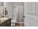 Bathroom features a shower-tub combo, and a single sink vanity with a brown granite countertop at 265 Valley Xing, Canton, GA 30114