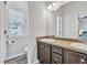Bathroom with granite counters and cabinets, with a view to an adjacent bedroom at 265 Valley Xing, Canton, GA 30114