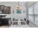 Dining area with modern chandelier and table set with marble top at 265 Valley Xing, Canton, GA 30114
