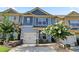 Charming townhome with well-maintained landscaping, a two-car garage, and welcoming curb appeal at 265 Valley Xing, Canton, GA 30114