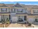 Charming two-story townhome with well-maintained landscaping and attached one car garage at 265 Valley Xing, Canton, GA 30114