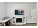 Bright office featuring a TV mounted above an electric fireplace with shelving at 265 Valley Xing, Canton, GA 30114