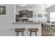 Modern kitchen boasts stainless appliances, granite countertops and seamless bar stool seating at 265 Valley Xing, Canton, GA 30114