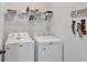 Well-lit laundry room with modern washer and dryer appliances at 265 Valley Xing, Canton, GA 30114