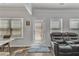 Bright living room featuring new hardwood floors and a plush reclining sofa at 265 Valley Xing, Canton, GA 30114