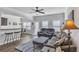 Open-concept living room with ample natural light, neutral colors, and modern furnishings at 265 Valley Xing, Canton, GA 30114