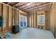 Unfinished basement with exposed framing, direct outdoor access and concrete floors for customization at 3206 Letha Woods Dr, Conyers, GA 30094