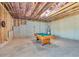 Spacious basement area with pool table offers potential for various recreational activities and customization at 3206 Letha Woods Dr, Conyers, GA 30094