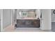 A primary bathroom features double sinks, custom cabinets, and tiled floors at 3206 Letha Woods Dr, Conyers, GA 30094