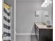 Neutral bathroom with granite vanity, framed mirror, decorative lights and a shower/tub combo at 3206 Letha Woods Dr, Conyers, GA 30094
