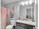Bathroom featuring vanity with storage, mirror and tile flooring at 3206 Letha Woods Dr, Conyers, GA 30094