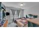 Bedroom featuring a bed, window, and mounted TV at 3206 Letha Woods Dr, Conyers, GA 30094