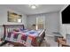 Bedroom featuring a bed, window, and mounted TV at 3206 Letha Woods Dr, Conyers, GA 30094