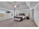 Spacious bedroom featuring trey ceiling and large windows at 3206 Letha Woods Dr, Conyers, GA 30094