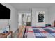 Bedroom featuring a bed, an open door and mounted TV at 3206 Letha Woods Dr, Conyers, GA 30094
