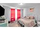 Bedroom with a bed, chair, white and pink curtains, and mounted TV at 3206 Letha Woods Dr, Conyers, GA 30094