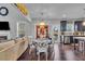 Open floor plan featuring a dining area, living room, and modern kitchen at 3206 Letha Woods Dr, Conyers, GA 30094