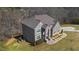 Aerial view of a stately brick home showcases its architectural details and landscaping at 3206 Letha Woods Dr, Conyers, GA 30094