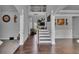 This home's foyer features dark wood floors, a staircase, and an overhead balcony at 3206 Letha Woods Dr, Conyers, GA 30094