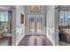 The light and airy foyer features dark hardwood floors and a decorative double-door entryway at 3206 Letha Woods Dr, Conyers, GA 30094