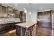 Modern kitchen showcasing a large island with barstool seating and sleek stainless steel appliances at 3206 Letha Woods Dr, Conyers, GA 30094