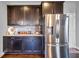 Stylish kitchen featuring granite countertops and stainless steel refrigerator at 3206 Letha Woods Dr, Conyers, GA 30094