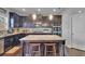 Modern kitchen featuring a spacious center island with barstool seating at 3206 Letha Woods Dr, Conyers, GA 30094