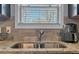 Close-up of the kitchen sink, granite countertops, and window at 3206 Letha Woods Dr, Conyers, GA 30094