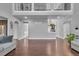 Large open living room with hardwood floors and neutral gray paint at 3206 Letha Woods Dr, Conyers, GA 30094