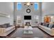 Bright living room featuring a fireplace, hardwood floors, and soaring ceilings at 3206 Letha Woods Dr, Conyers, GA 30094