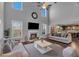 Spacious living room featuring a fireplace, high ceilings, and an open floor plan, ideal for Gathering gatherings at 3206 Letha Woods Dr, Conyers, GA 30094