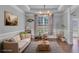 Bright living room with modern decor, hardwood floors, and stylish chandelier, perfect for entertaining guests at 3206 Letha Woods Dr, Conyers, GA 30094