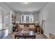 A well-lit living room with a brown sofa and a variety of decorative items at 3206 Letha Woods Dr, Conyers, GA 30094