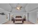 Large main bedroom with vaulted ceiling, carpet, and lots of windows at 3206 Letha Woods Dr, Conyers, GA 30094