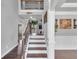Foyer entry with a view of the home's staircase and upstairs hallway with decorative lighting at 3206 Letha Woods Dr, Conyers, GA 30094