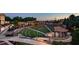 Outdoor amphitheater with manicured landscaping and lighting, creating a vibrant gathering space at 420 Eagle Tiff Dr, Sugar Hill, GA 30518