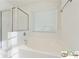 This bright bathroom boasts a tub, a shower, and plenty of natural light at 420 Eagle Tiff Dr, Sugar Hill, GA 30518