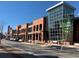 An exterior view of a red brick building with lots of windows on a sunny day at 420 Eagle Tiff Dr, Sugar Hill, GA 30518