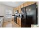 Modern kitchen featuring stainless steel appliances, lots of natural light, and hardwood floors at 420 Eagle Tiff Dr, Sugar Hill, GA 30518