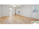 Large main bedroom featuring hardwood floors, ceiling fan, and ensuite bathroom and walk-in closet at 420 Eagle Tiff Dr, Sugar Hill, GA 30518