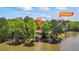 Stunning aerial view of lakefront home surrounded by lush greenery offering privacy and scenic views at 50 Silver Lake Dr, Mansfield, GA 30055