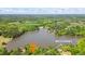 View of lake with lots of wooded areas, showcasing muscadines highlighting the property's natural setting at 50 Silver Lake Dr, Mansfield, GA 30055