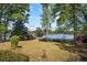 Lush backyard with a view of the lake and access to the lake at 50 Silver Lake Dr, Mansfield, GA 30055