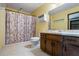 Cozy bathroom with a shower, toilet, and vanity with marble countertops and dark-stained cabinets at 50 Silver Lake Dr, Mansfield, GA 30055