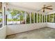 Screened in porch overlooking the lake with white walls and ceiling fan at 50 Silver Lake Dr, Mansfield, GA 30055