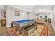 Finished basement featuring an open space, pool table, living area, and laminate flooring at 5895 Springbox Dr, Suwanee, GA 30024