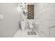 Modern bathroom features updated tiling and a unique pedestal sink at 5895 Springbox Dr, Suwanee, GA 30024
