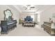 Large bedroom with trey ceiling, carpet, and antique furniture sets a luxurious tone at 5895 Springbox Dr, Suwanee, GA 30024